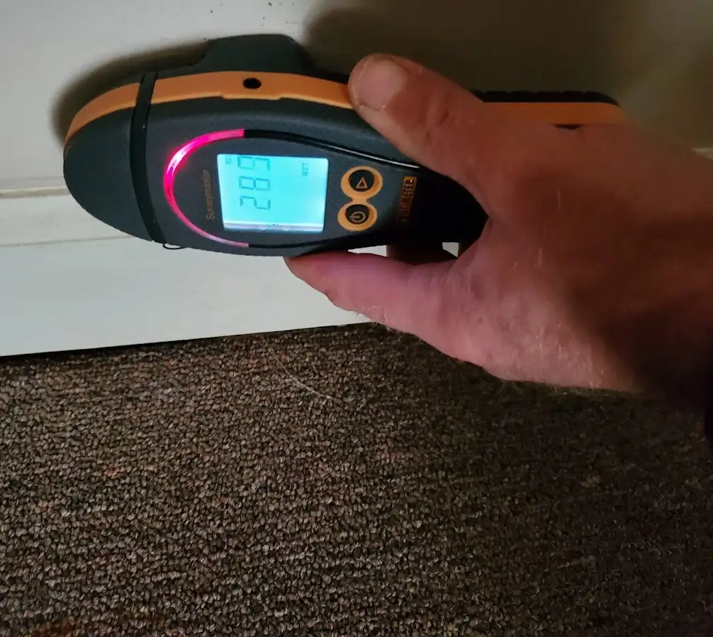 Moisture detection at baseboard during Storm Damage Restoration in Oviedo